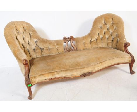 A Victorian 19th century double ended chaise lounge / sofa / settee. With arched, button back back rest. With serpentine fron