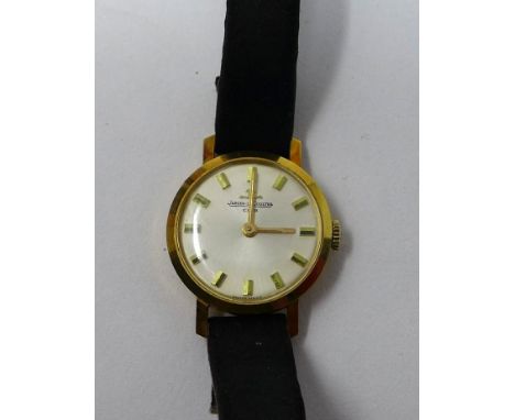 A vintage 18ct yellow gold cased Jaeger LeCoultre ladies wristwatch on original black leather strap, silvered dial and yellow