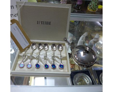 A boxed set of six silver plated Le Verre peacock teaspoons, design by Yashima, together with a plated sugar bowl, with flora