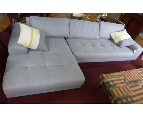 A contemporary corner sofa with chrome legs 