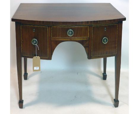 A Georgian mahogany bow front side table, with three drawers, raised on tapered legs, H.76 W.92 D.53cm 