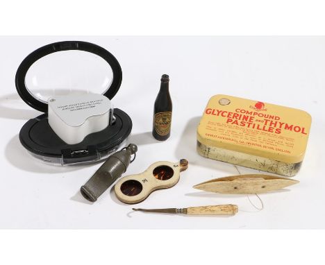 Jewellers folding magnifying glas with light, folding ring sizer, whistle, miniature Guinness bottle pen, two bone sewing acc