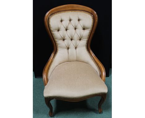 Victorian style button back easy chair, on cabriole legs