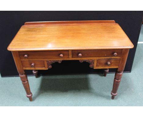 Victorian mahogany writing table, with raised upstand above four frieze drawers and scroll carved kneehole, on turned legs, 1