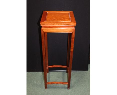 Chinese style hardwood jardiniere stand, the square top raised on square legs united by shaped stretchers, 30cm square