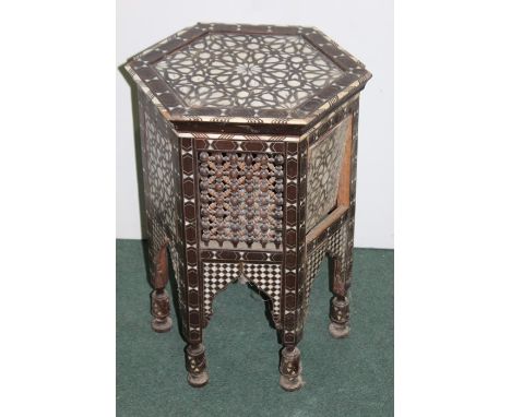 Middle Eastern occasional table, set with bone and mother of pearl and a panel and fret base 