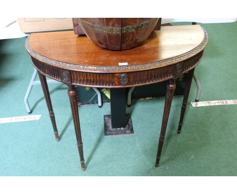 Mahogany demi-lune occasional table, with carved reeded frieze, on reeded legs 91cm wide