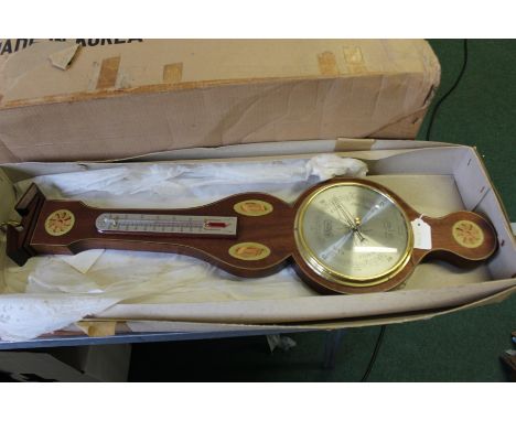 Comitti barometer/ thermometer, housed in a shell marquetry effect case, 71cm x 18cm