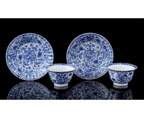 2 contoured porcelain cups and saucers with blue decor of a butterfly among flowers, among others. in cartouches, marked linz