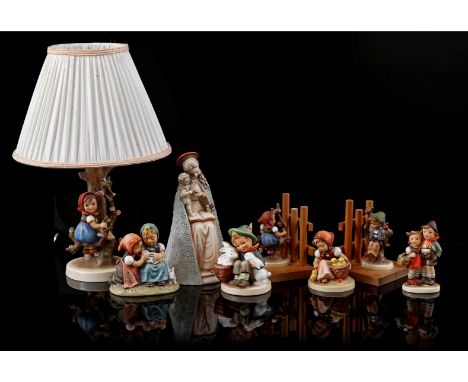8 porcelain Goebel Hummel statues incl. lamp and 2 bookends, highest 36 cm (2 are glued)