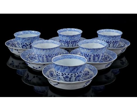 6 contoured porcelain cups and saucers with blue floral decoration and bird between blossoms in heart, Kangxi marked, China 1