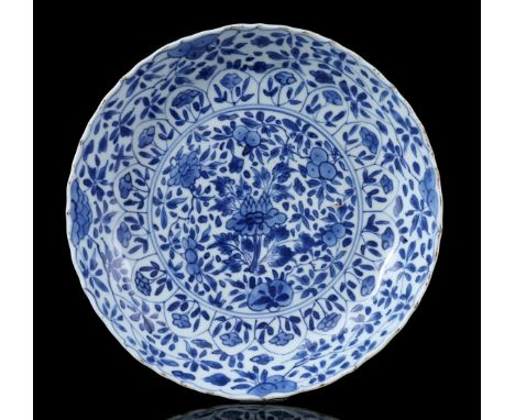 Porcelain dish with blue floral decor of lotus, marked with Jade, China Kangxi period ca. 1700, 22 cm diameter (fritting)