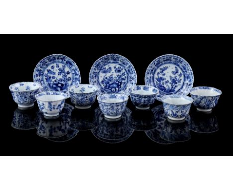 7 porcelain cups and 3 saucers with different blue floral decor, various marked, China Kangxi period ca. 1700 (various damage