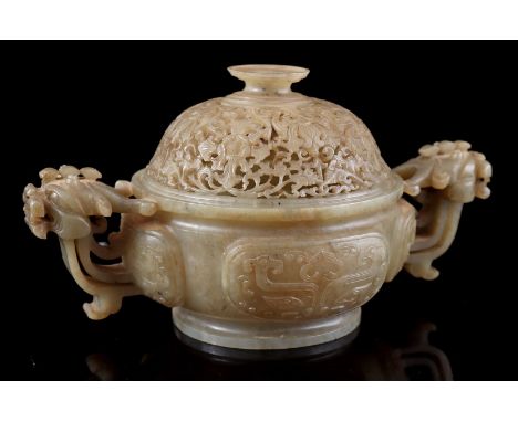 Jade incense burner with decor of a face, handles in the shape of a temple lion and richly decorated openwork lid, China 19th
