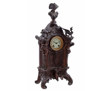 Zamak mantel clock with rich decor with lady in traditional dress on top, 2 griffins on either side of the dial with brass ed