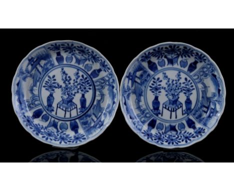 2 contoured porcelain dishes with blue decor of vases, table, flowers and pagoda on a lake, Kangxi marked, China 19th century