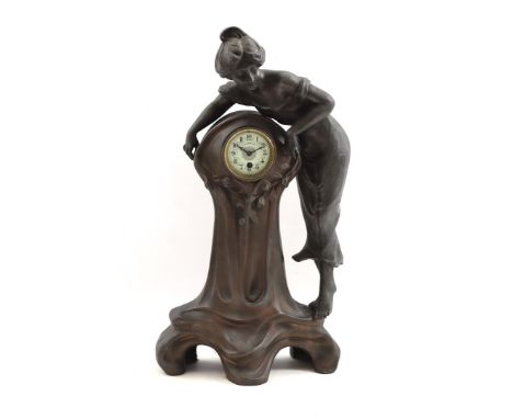 Zamak table clock flanked by a standing lady, dial marked Redoute Fils, Art Nouveau period, ca. 1910, 64 cm high (figure is i