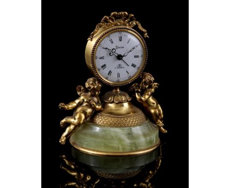 Swiza bronze table clock with alarm clock, bow crest, putti on sides and onyx base, 12.5 cm high