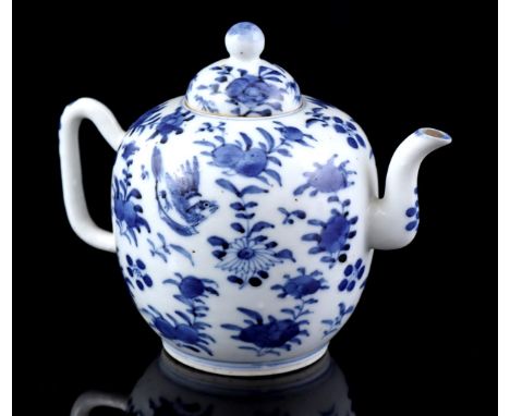 Porcelain teapot with blue decor of a bird among flowers, Kangxi marked, China 19th century, 12 cm high (hairline and chip)