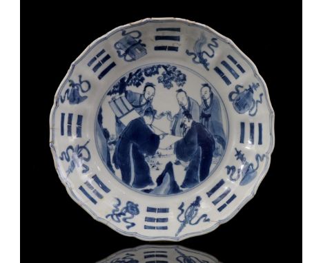Porcelain contoured dish with blue decor of a scene with philosophers in the heart and decorated edge of 8 antiquities and tr