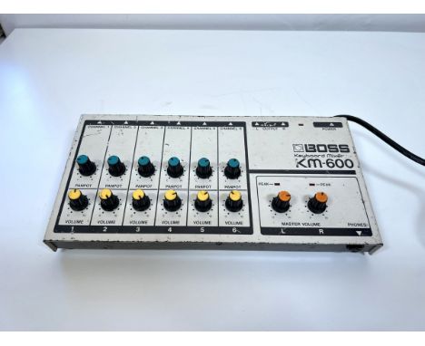 Boss KM-600 Mixer - 1970s 6-channel mixer.Tested. Passes signal. All pots crackle, channel 6 does not pass audio. 120vNo guar
