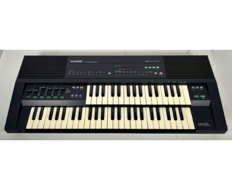 Casio DM-100. Rare dual keyboard synth/sampler with some classic Casio preset sounds. (B) Tested and working - powers up and 