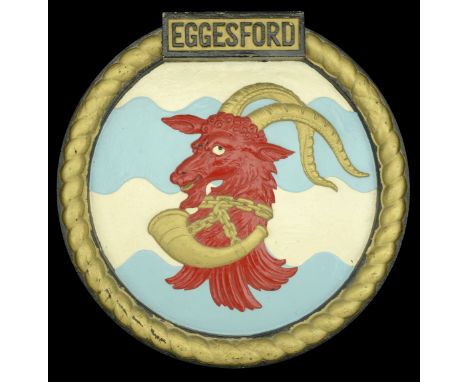 A H.M.S. Eggesford Ship’s Crest. A large cast iron ship’s crest, 360mm diameter, approximately 10.5kg, depicting on a field o