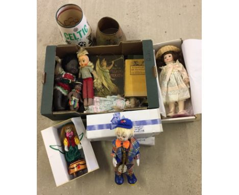 A box of assorted vintage toys and books. To include boxed ceramic dolls, vintage football lampshades and picture books. 