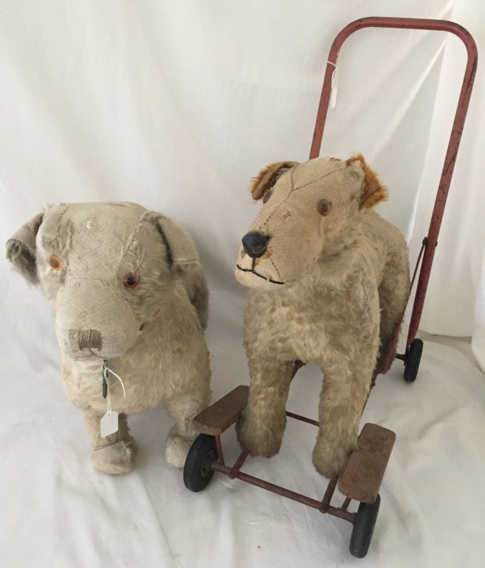 2 vintage dog toys one on wheels. One is by Deans but it no longer