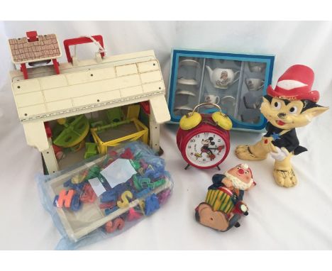 A collection of vintage toys  and figures. Comprising a Fisher Price school house, a boxed porcelain child's tea set, a Walt 