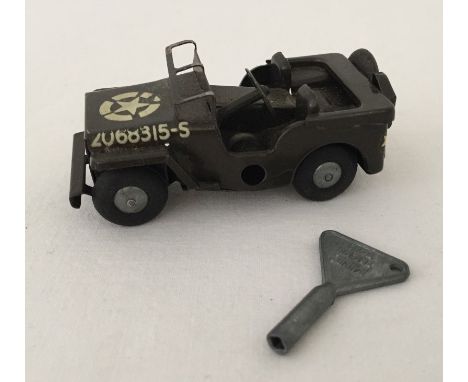 A Tri-ang Minic US Army jeep with key. In working condition. Unboxed. 