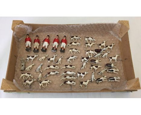 A quantity of vintage Britains lead hunting figures. Comprising 5 huntsmen on foot and 42 hounds in various poses. 