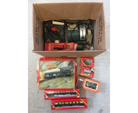 A box of vintage OO Gauge railway items to include clockwork tank engine in box with track. Together with unboxed electric Tr