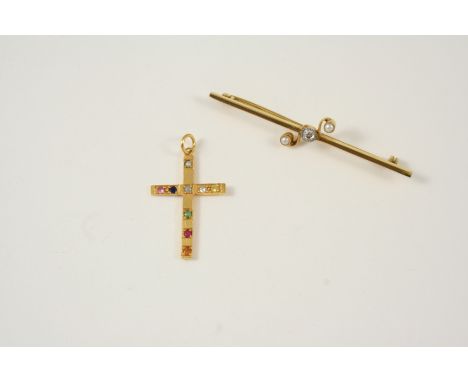 A GOLD AND GEM SET CRUCIFORM PENDANT set with assorted gem stones, including ruby, emerald, sapphire and pearl, 3cm. long, to