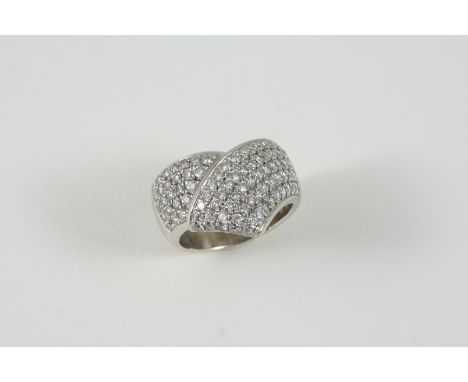 A DIAMOND AND 18CT. WHITE GOLD RING the cross-over design  is set overall with circular-cut diamonds. Size M.