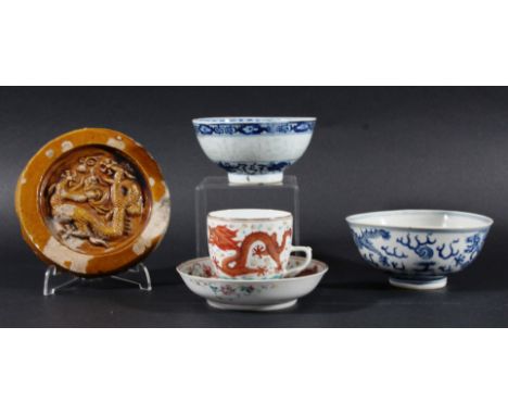 CHINESE FAMILLE ROSE CUP AND SAUCER, painted with iron red scrolling, five clawed dragons chasing flaming pearls, on an ename