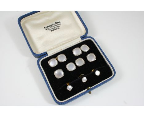 A CASED SET OF MOTHER-OF-PEARL AND GOLD CUFFLINKS AND DRESS STUDS all set with an oval section of mother-of-pearl within an 1