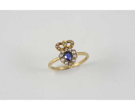 A SAPPHIRE, PEARL AND DIAMOND RING the pear-shaped sapphire is set within a surround of small pearls and one circular diamond