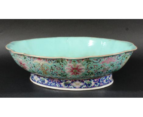 CHINESE FAMILLE ROSE DISH, of shaped oval form, enamelled with lotus and camellia flowers, bats and buddhist 'double joy' sym