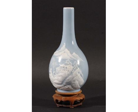 CHINESE BOTTLE VASE, with pate sur pate style decoration of a fisherman before steps up a mountain topped by a shelter on a p