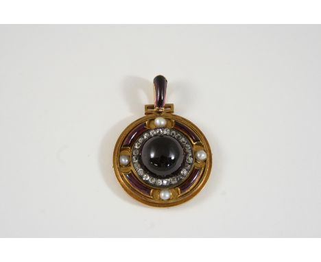 A LATE VICTORIAN GARNET AND DIAMOND PENDANT the circular gold mount is centred with a circular cabochon garnet within a surro
