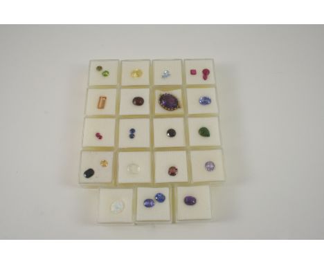 A QUANTITY OF LOOSE COLOURED GEMSTONES of various shapes and sizes, including sapphire, ruby, topaz, spinel, aquamarine, garn