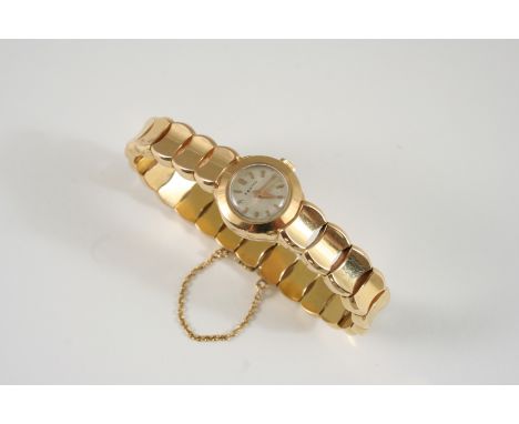 A LADY'S GOLD WRISTWATCH BY ZENITH the signed circular dial with baton numerals, on an integrated fancy link bracelet, number