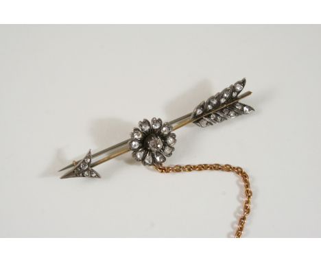 A VICTORIAN DIAMOND ARROW BROOCH set with rose-cut diamonds, in silver and gold, 6cm. long.
