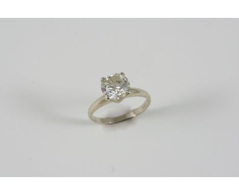 A DIAMOND SOLITAIRE RING the brilliant-cut diamond weighs approximately 1.75 carats and is set in white gold. Size K 1/2.