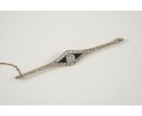 AN ART DECO BLACK ONYX AND DIAMOND BROOCH the central cluster of old brilliant-cut diamonds is set with sections of black ony