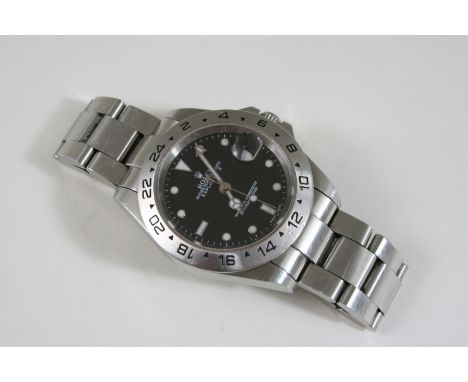 A GENTLEMAN'S STAINLESS STEEL EXPLORER II WRISTWATCH BY ROLEX the signed black circular dial with dot, dagger and baton numer