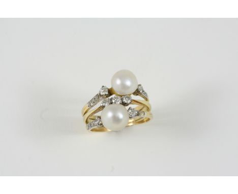 A NATURAL PEARL AND DIAMOND RING  the two natural pearls are set with rose-cut and old brilliant-cut diamonds, in gold. Size 