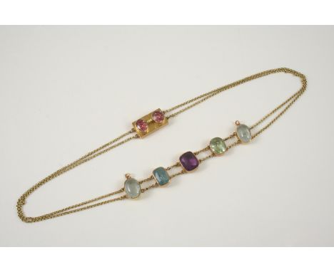 A GOLD AND GEM SET NECKLACE the gold double row chain necklace is mounted with assorted gemstones, including moonstone, ameth