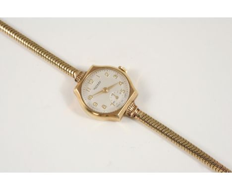 A LADY'S 9CT. GOLD WRISTWATCH BY ROTARY the signed circular dial with Arabic numerals and subsidiary seconds dial, on a gold 